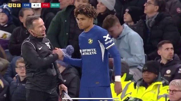 Chelsea youngster Michael Golding is congratulated by the referee on his debut for the club