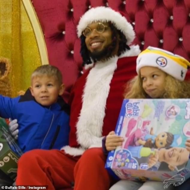 Damar Hamlin posed with children during his fourth annual toy drive in Pennsylvania last month