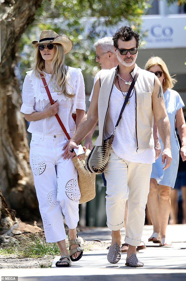 Elle Macpherson and her boyfriend Doyle Bramhall wore matching boho outfits as she showed him around Bondi Beach on Tuesday