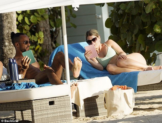 Theo and his wife Melanie, who tied the knot in 2013, enjoyed some relaxing time reading on their loungers