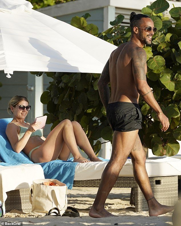 Theo Walcott went shirtless with his wife Melanie in Antigua on Friday