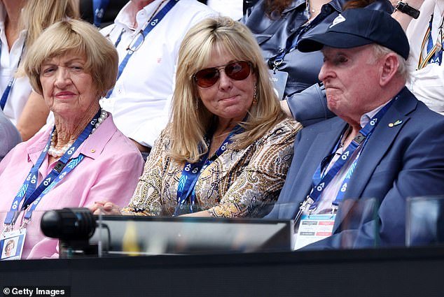 Margaret Court (left) sat next to fellow Australian tennis legend Rod Laver (right) and his partner Susan Johnson (centre)