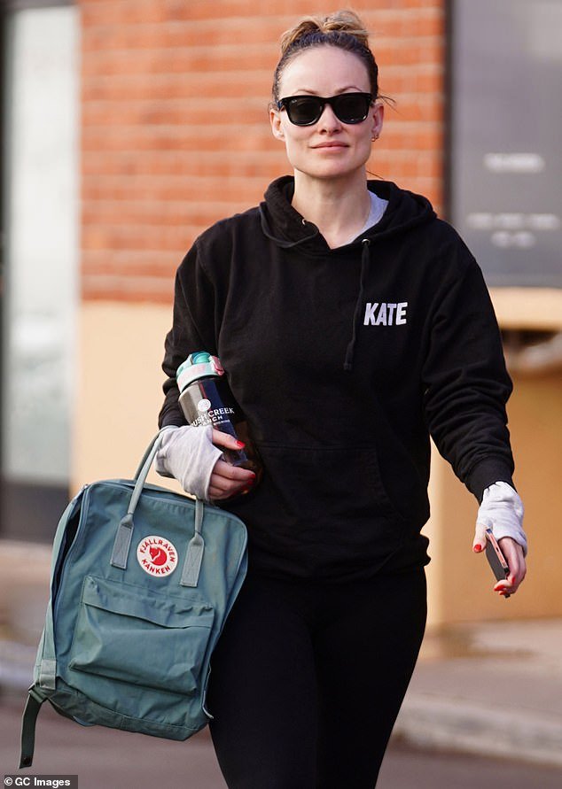 Olivia Wilde left her daily workout in a statement sweatshirt, but what that statement is remains a mystery