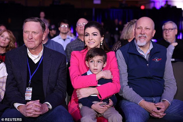 From left: Iowa evangelical leader Bob Vander Plaats, Casey DeSantis with son Mason, five, and Rep. Chip Roy (R-Texas) sit in the front row of Governor DeSantis' town hall in West Des Moines, Iowa, on Tuesday evening