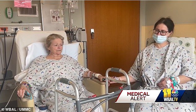 Julia and Eileen are seen at the University of Maryland Medical Center in Baltimore sitting in their hospital gowns and marveling at their 'incredibly rare' outcome