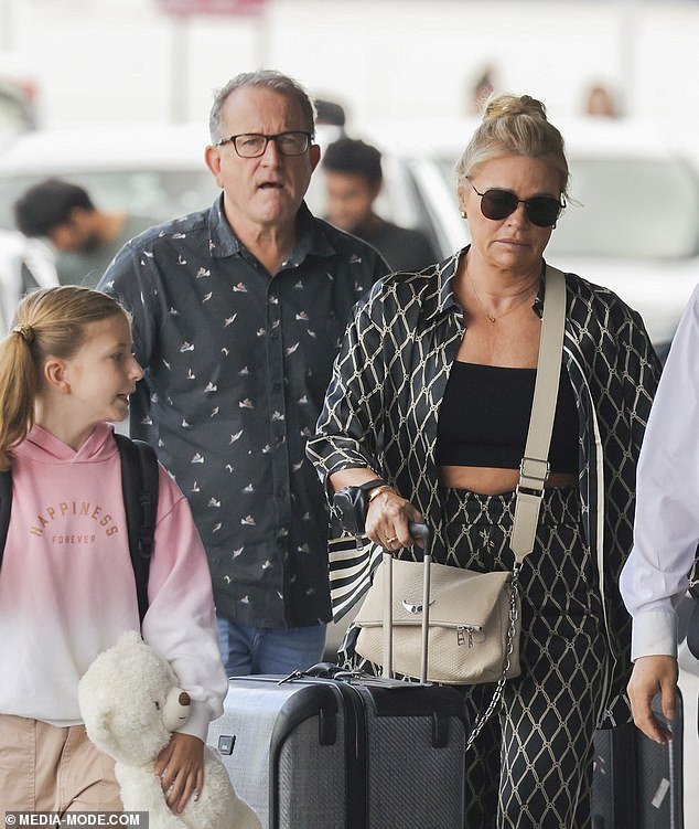 Sonia Kruger looked effortlessly stylish as she and her partner Craig McPherson made a rare public appearance together at Sydney Airport on Friday