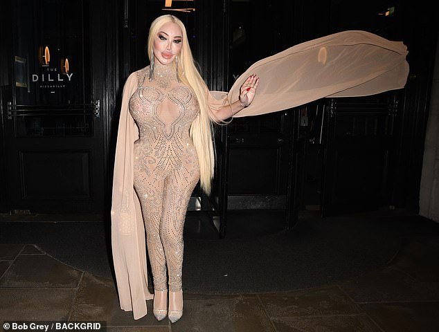 The star appeared in good spirits as she posed outside the restaurant and showed off her dramatic sleeves