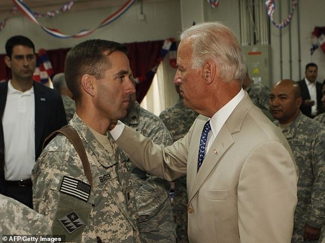 Beau Biden served in the Delaware National Guard when Joe Biden was vice president (above);  President Biden has repeatedly said he believed Beau's cancer was caused by being near burns in Iraq when Beau was stationed there.