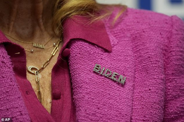 First lady Jill Biden wears a pin in support of her husband, President Joe Biden, during a visit to the Biden campaign headquarters in Wilmington