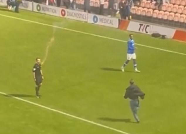 The referee was also hit by a flare thrown from the stands, apparently from the home side