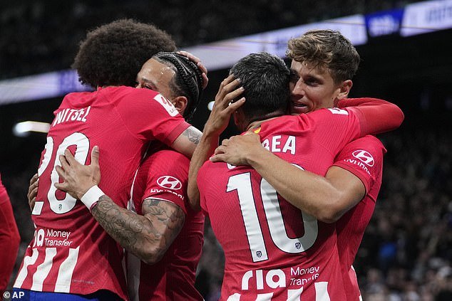 Marcos Llorente (R) celebrated with his teammates after scoring the dramatic equalizer