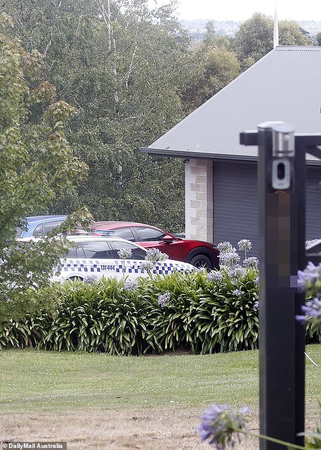 A police car was in the driveway of Mrs. Murphy's home Wednesday morning