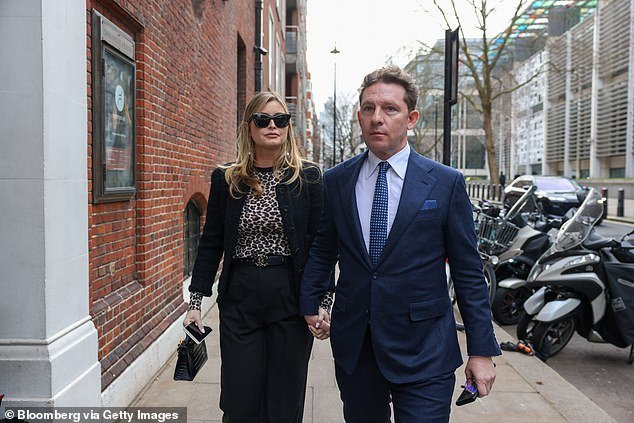 Holly attended a meeting of far-right members of the British Tory party in London with her husband Nick Candy.  Both shown