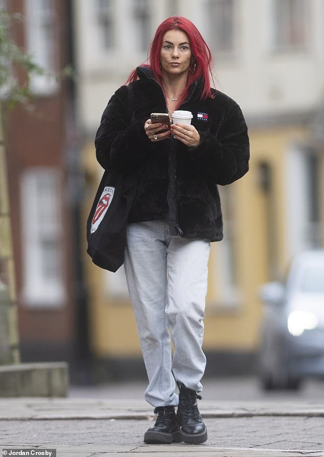 Meanwhile, his dance partner Dianne Buswell, 34, cut a casual figure in gray track bottoms which she paired with a cozy Tommy Hilfiger black fur coat.