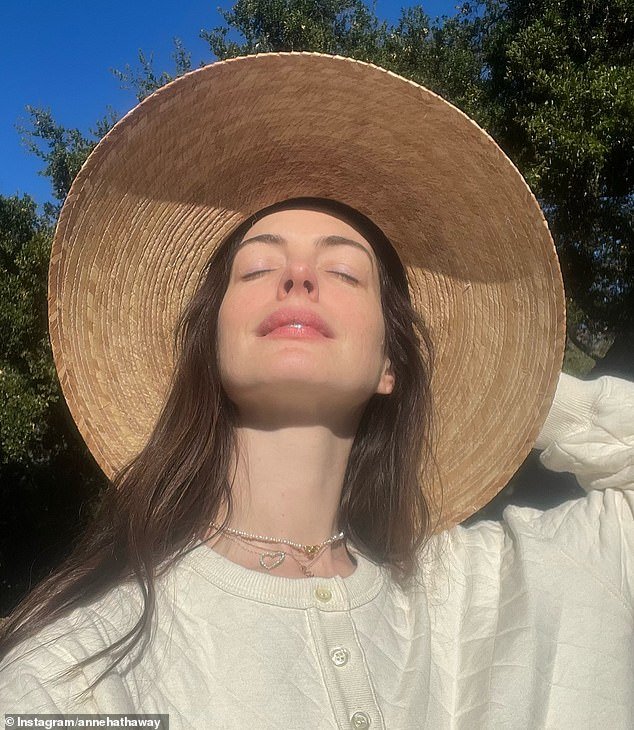 Anne Hathaway, 41, who briefly had a pixie but now shows off her thick, long hair