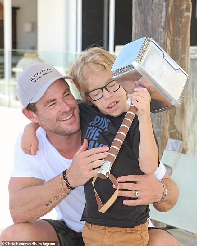 The Thor star took time out of his busy schedule to shine a light on a very special boy.  In one image, Chris embraces Amon as he shows off his amazing strength while wielding the Norse God's famous hammer, Mjölnir.  Pictured