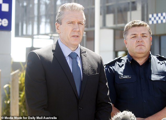 Detective Acting Chief Inspector Mark Hatt (left) addressing a media pack outside the Ballarat West Police Station on Friday