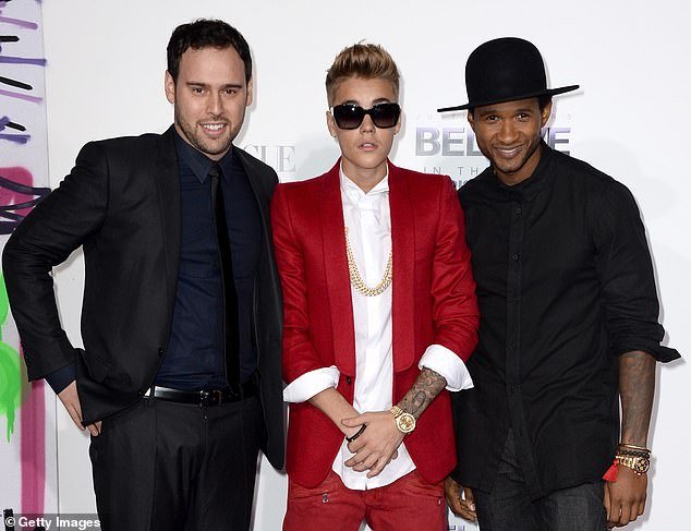 Usher signed him to his new joint venture in 2008, along with talent manager Scooter Braun, and the pair collaborated on Somebody to Love – the second single from Justin's first studio album, My World 2.0.  (photo 2013)