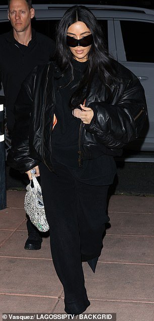 Kim easily carried a $6,950 Balenciaga bag with rhinestone detailing in her right hand