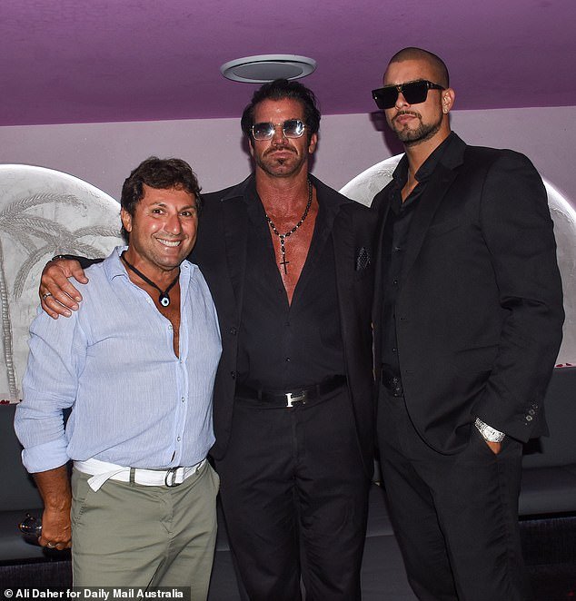 Also at the party was former MAFS groom Nasser Sultan (left), who posed arm-in-arm with tobacco magnate Travers 'Candyman' Beynon (center) and his son Valentino (right)