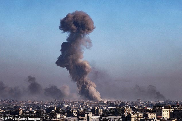A photo taken from Rafah shows clouds of smoke during the Israeli bombardment of Khan Yunis in the southern Gaza Strip