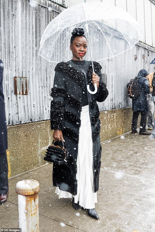 Black Panther actress Danai Gurira braved the elements for the show, wearing a long black fur coat and white skirt
