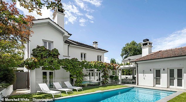 Located in Melbourne's prestigious suburb, the sprawling home features five bedrooms, four bedrooms, a swimming pool and a tennis court.  In the photo: the swimming pool area