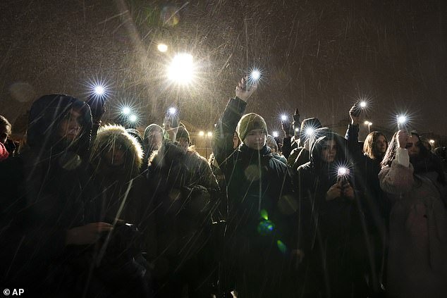 Mourners commemorate the death of the outspoken Russian critic in snowy conditions