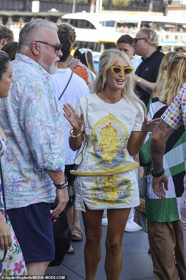 Her radio host Kyle Sandilands led the arrivals at the boat meeting point as they took part in the festivities