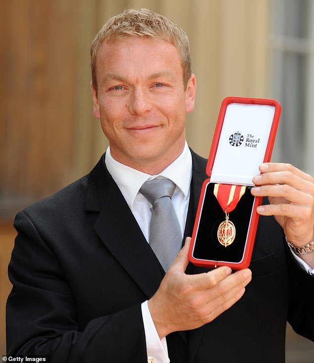 Hoy poses with the Knighthood that he received from the Prince of Wales in 2009