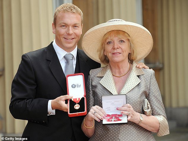 The Scot poses next to his mother Carol Hoy at Buckingham Palace after he was knighted and she received an MBE