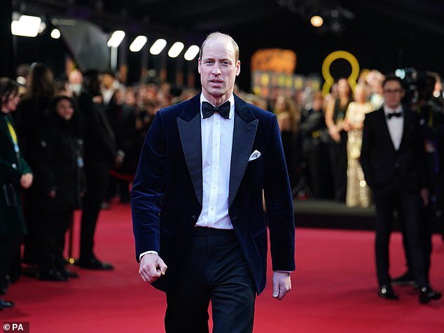 The 42-year-old royal walks the carpet alone at the Royal Festival Hall ahead of tonight's ceremony