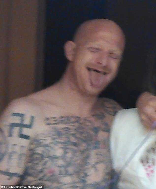 In several photos posted online, McDougal proudly displays his swastika tattoo
