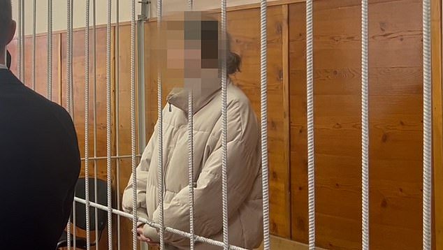 Karelina is seen in Russian court with a blurred face