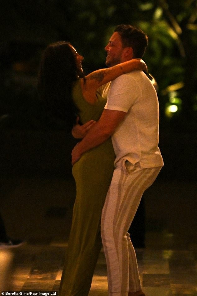 Diags picked her up and wrapped his arms around her