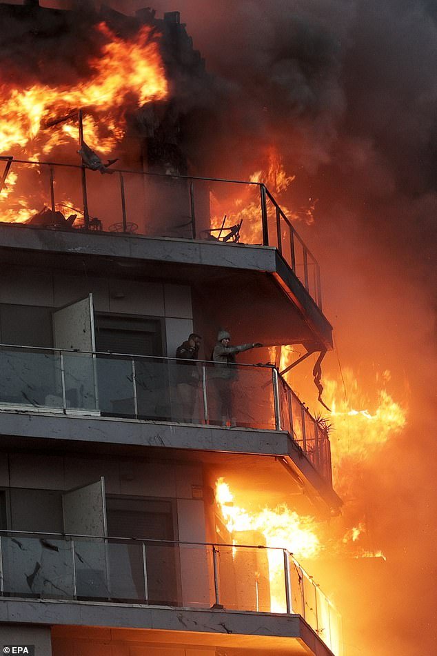 Residents were trapped on their balconies - just meters from the flames - as they waited for firefighters to rescue them from the inferno