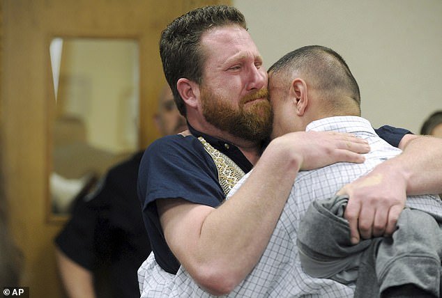 Christopher Tapp, right, and Jeremy Sargis, who was also originally connected to the crime but whose charges were dropped, embrace during Tapp's post-conviction hearing at the Bonneville Courthouse in Idaho Falls, Idaho.