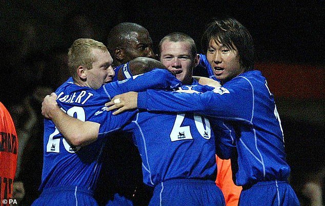 Li celebrates an Everton goal with Wayne Rooney during a Premiership match in 2002