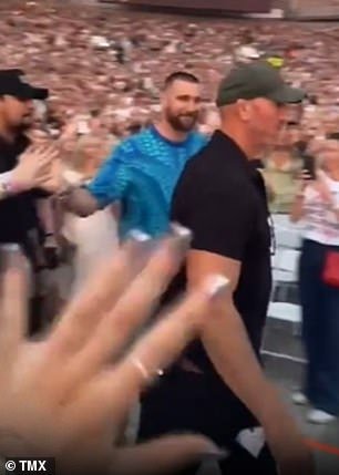 Travis (seen walking through the crowd at Taylor's show) landed in Sydney on a private jet on Thursday morning