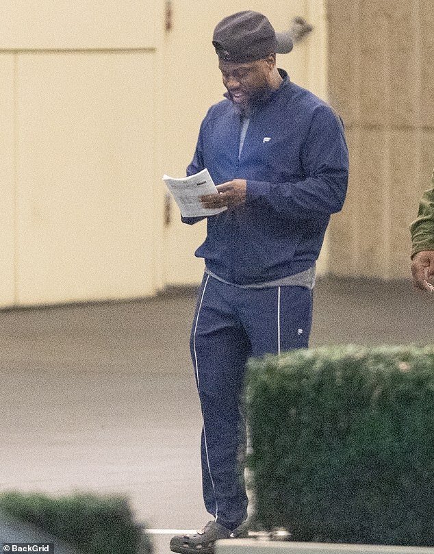 Kevin Hart, 44, looked relaxed in a black zip-up jacket, matching pants and a pair of sneakers