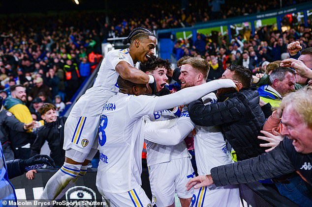 Jubilant Leeds players celebrate after Gray put them ahead against Leicester