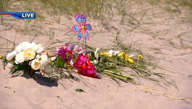 People have left tributes for the seven-year-old on the beach in Fort Lauderdale