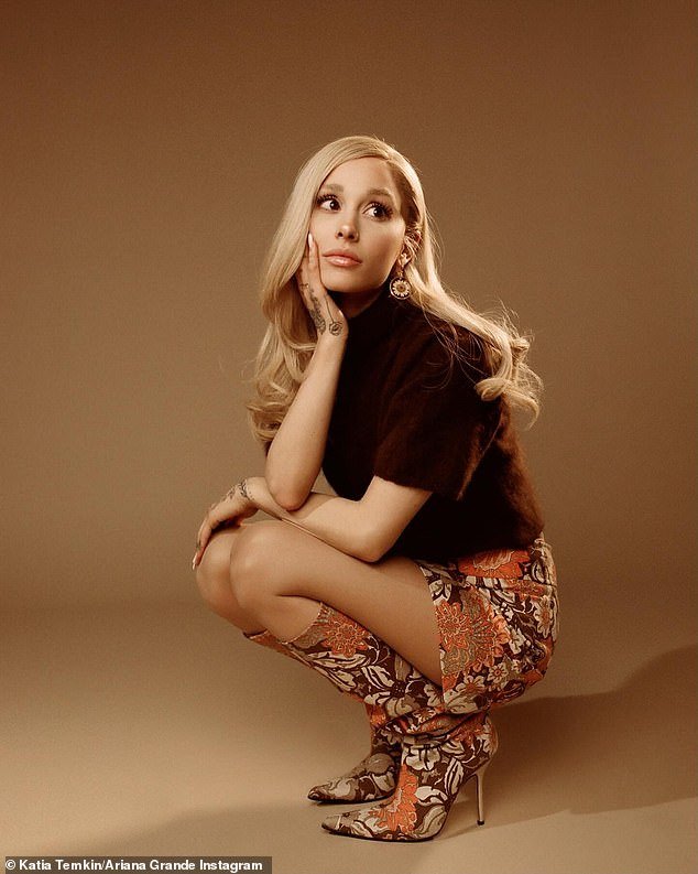 The singer used her official Instagram account to upload the images in which she poses in a crouched position with one hand under her chin and the other on her lap.  She is seen on a monotone beige background of a photo studio.  Her long blonde hair is parted on the side with some curl at the ends, running down her back
