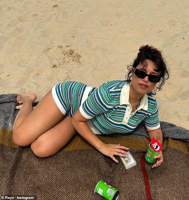 The 26-year-old singer, who has received a record seven nominations for the 2024 BRIT Awards, looked completely relaxed as she lay on a blanket on the beach.