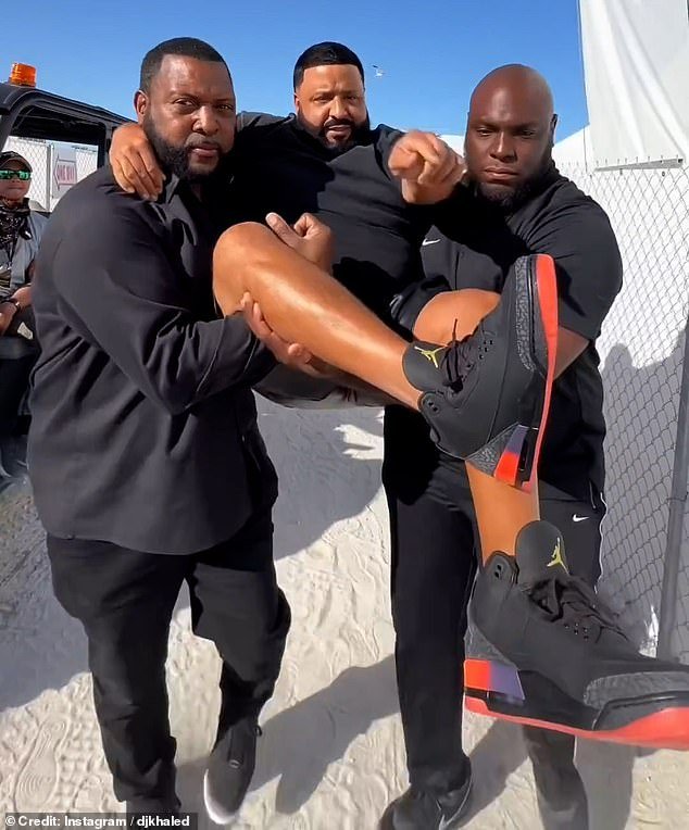 DJ Khaled was carried from his car to the stage by two bodyguards for his performance in Miami Beach on Sunday - all because he didn't want to get his Jordans dirty (see the video the rapper shared on Instagram)
