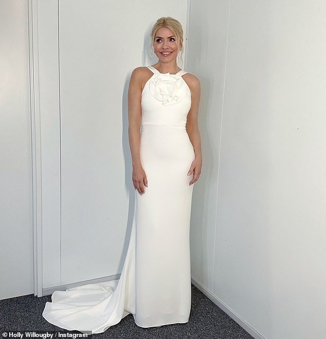 Holly Willoughby cut a very glamorous figure in a stunning ivory white dress as she presented Dancing On Ice on Sunday evening