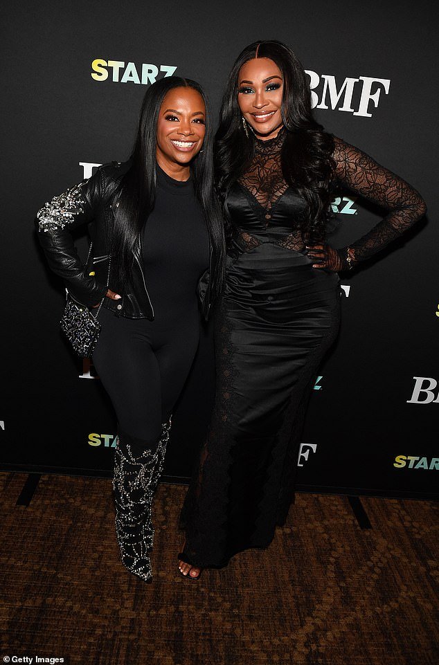 Kandi Burruss reunites with Real Housewives of Atlanta star Cynthia Bailey on the red carpet of a special screening of BFM