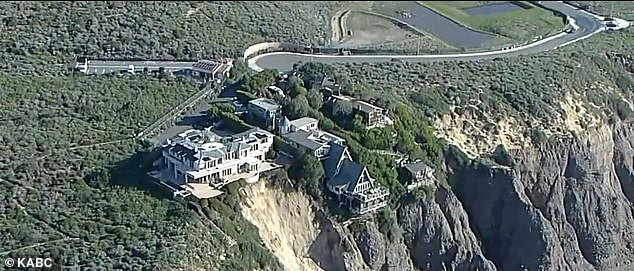 The collapse occurred Friday on Scenic Drive in Dana Point, causing mud and debris to slide down the 160-foot gorge.  As of Sunday, no evacuations had been ordered and engineers were assessing the structural integrity of the homes – the only three on the road.  the cliff