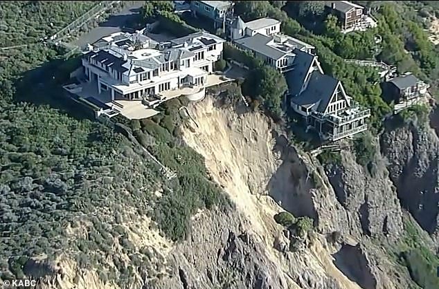 Three multimillion-dollar homes in Southern California are teetering precariously on the edge of a cliff after a landslide this weekend