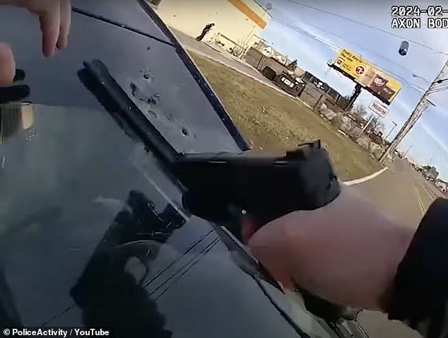 The sergeant opens fire several times through the windshield while clinging to the vehicle
